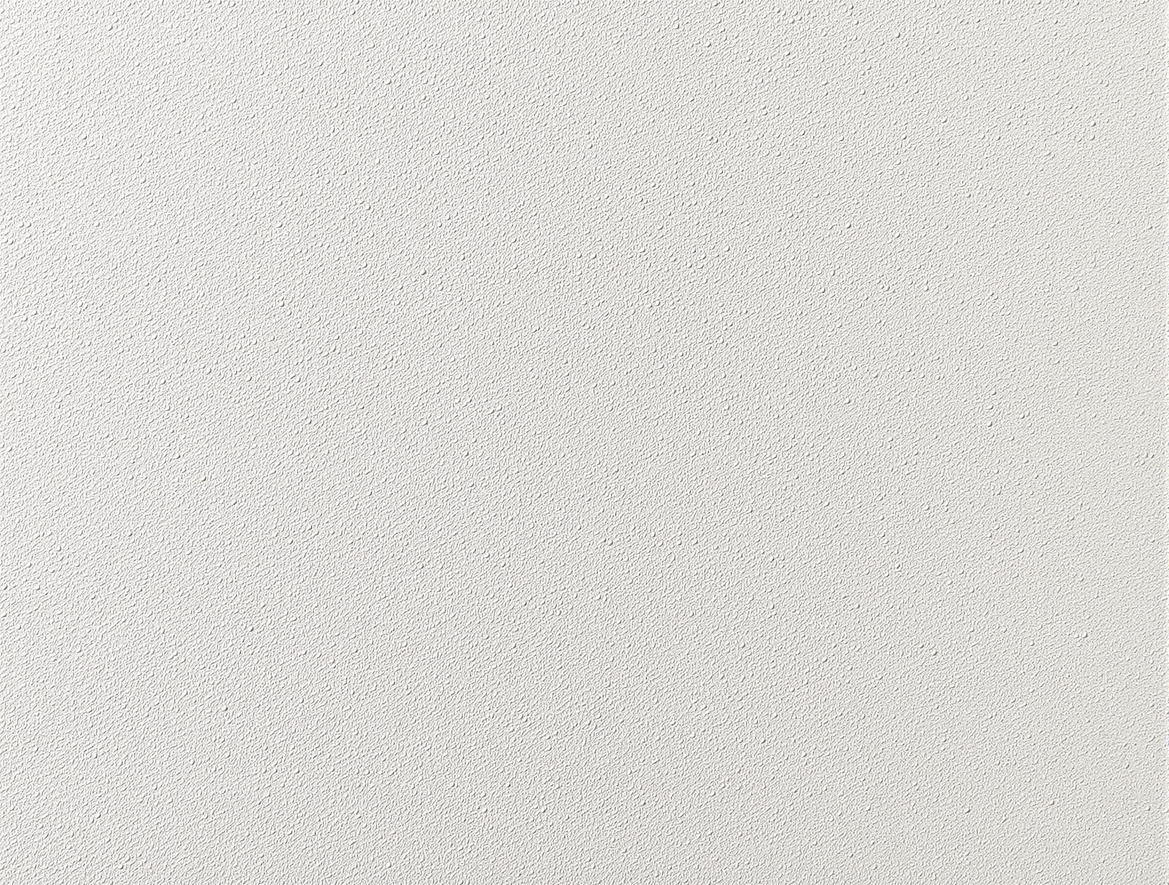 gros plan mur satiné révélant défauts à la lumière